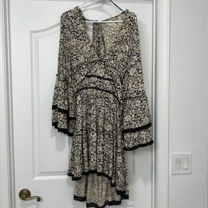 Free people dress, large, cream and black with an open back and bell sleeves.